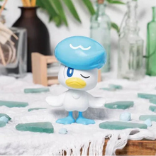Completed Bandai Quaxly Pokémon model kit displayed with blue decorative accents