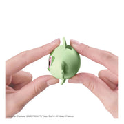 Sprigatito Pokémon model kit head pieces being pressed together during snap-fit assembly